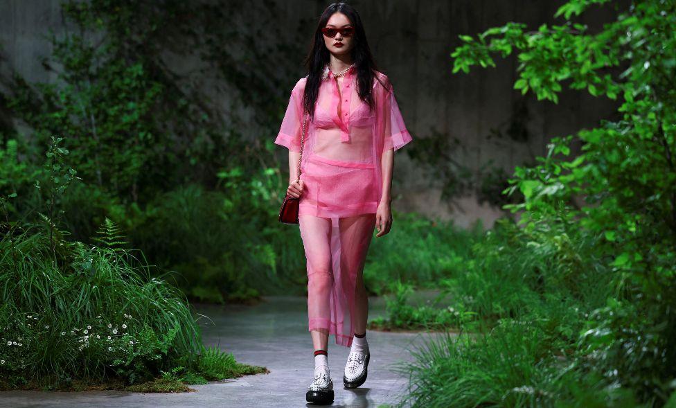 A model presents creations by Gucci at a fashion show in the Turbine Hall at Tate Modern, in London, Britain May 13, 2024. 