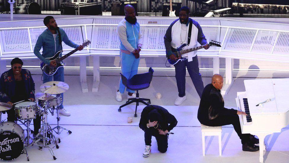 Eminem taking the knee against racism when performing in the hip-hop all-star lineup at 2022's Super Bowl 