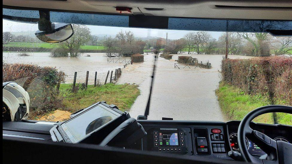 Charmouth Fire Station crew at floodwater rescue