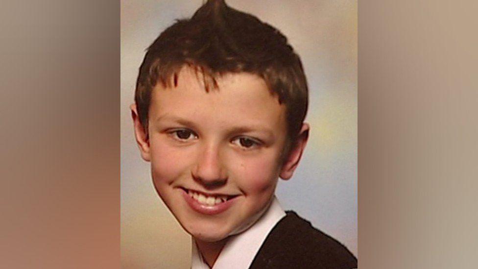 Oliver King, who has short brown hair and is smiling at the camera