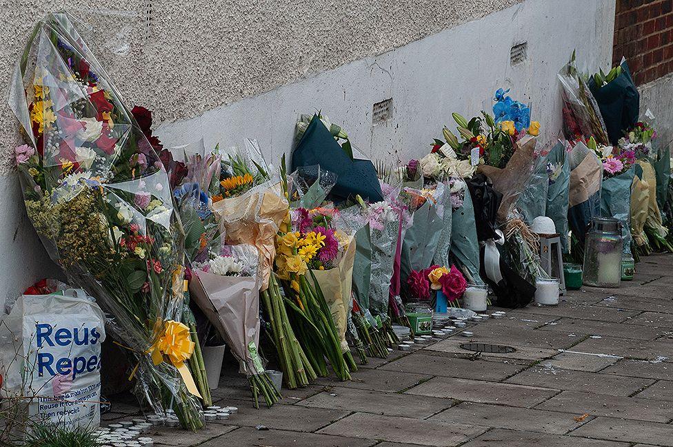 Floral tributes are left in Kirkstall gardens following the shooting of Chris Kaba, also know as the rapper Madix on September 8, 2022 in London, England. Chris Kaba, 24, was shot dead by a Met Police Officer after a police pursuit of a car ended in Streatham Hill on Monday night. No firearms have been found a the scene. (Photo by Guy Smallman/Getty Images)