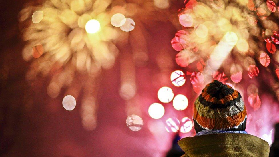 child watching fireworks display