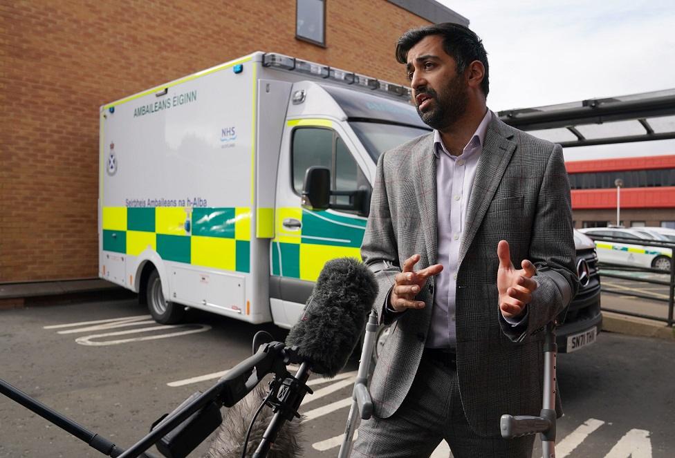 Humza Yousaf next to ambulance