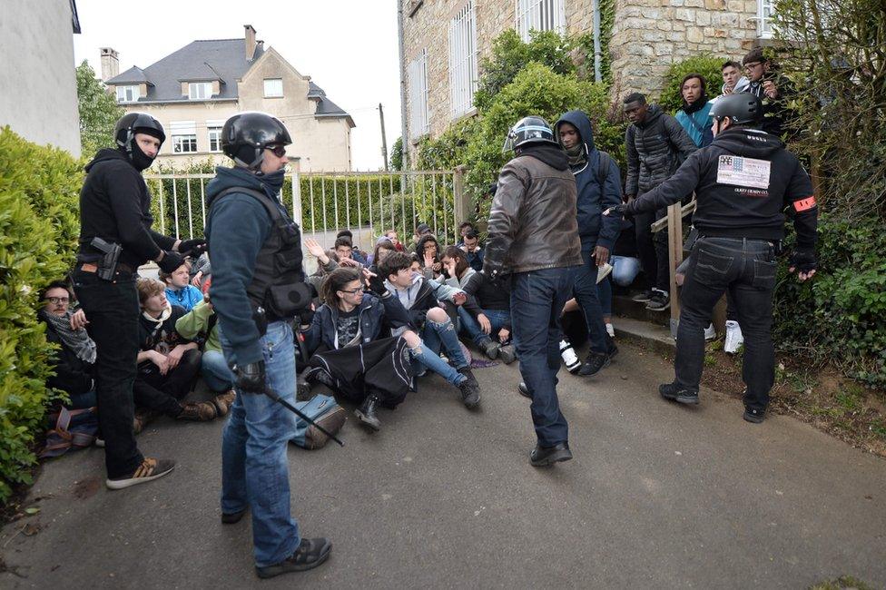 French police arrest protesters after a demonstration against the results of the first round of the French presidential election on 27 April 2017 in Rennes