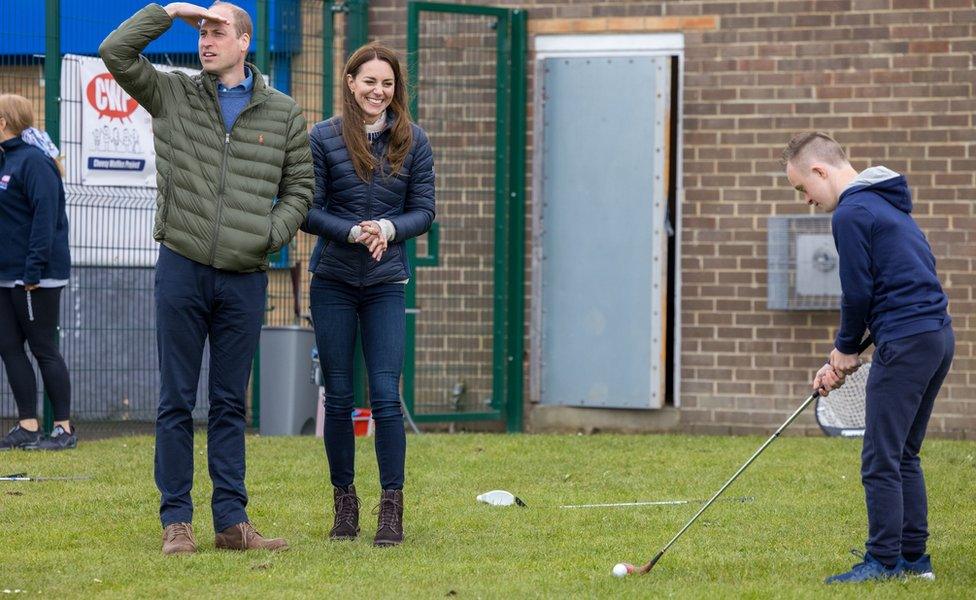 William and Kate watch a game of golf