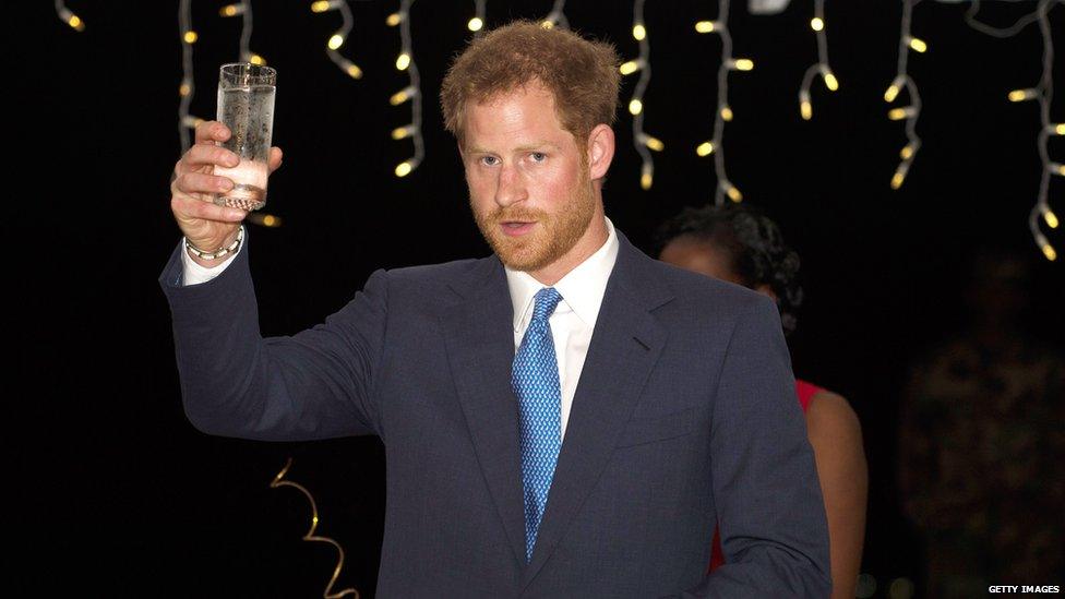 Prince Harry with a glass of water