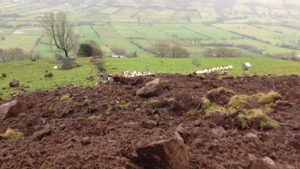 Dermot McDonnell's house is downhill from the landslide and he said the debris is still moving because it is still raining