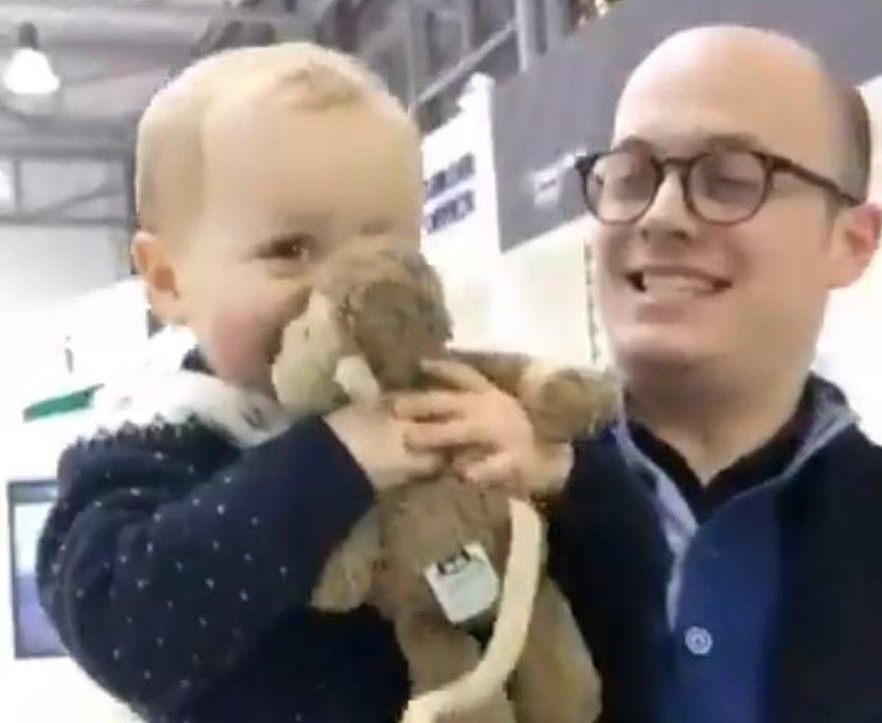 Finn with his father, Keir Regan-Alexander, being reunited with Mac the monkey