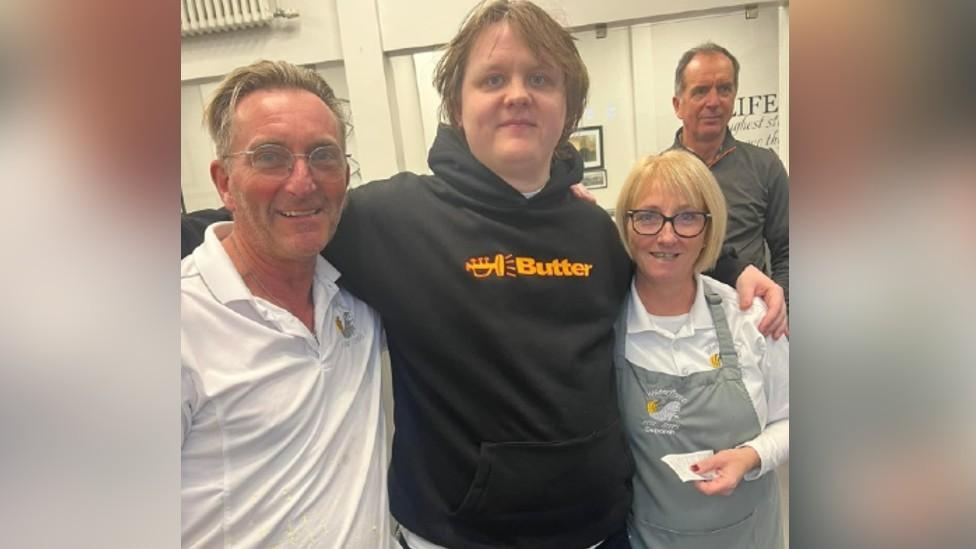 Lewis Capaldi with staff