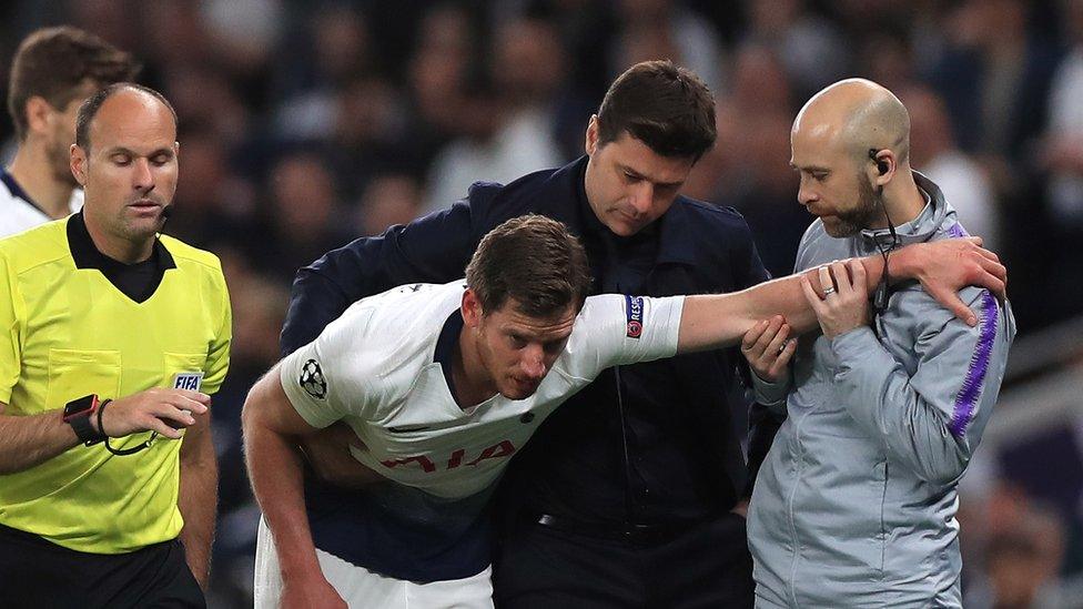 Vertonghen held up by a physio and his manager