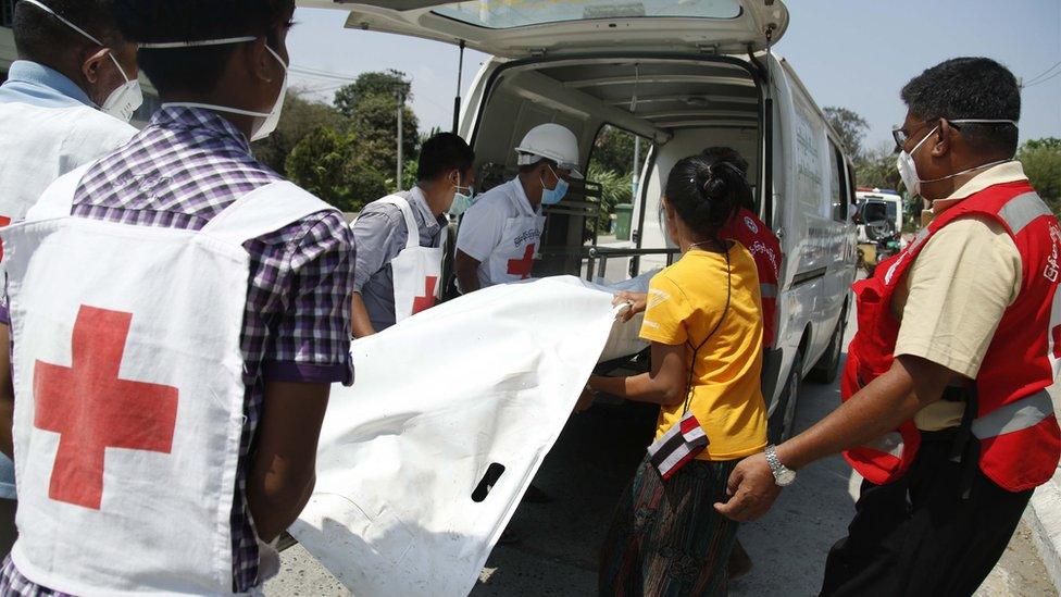 Members of the Myanmar Red Cross society move a the body of Pyae Sone Win Maung from a boat to an ambulance that will transport to Sittwe Hospital, in Sittwe, Rakhine State, western Myanmar, 21 April 2020