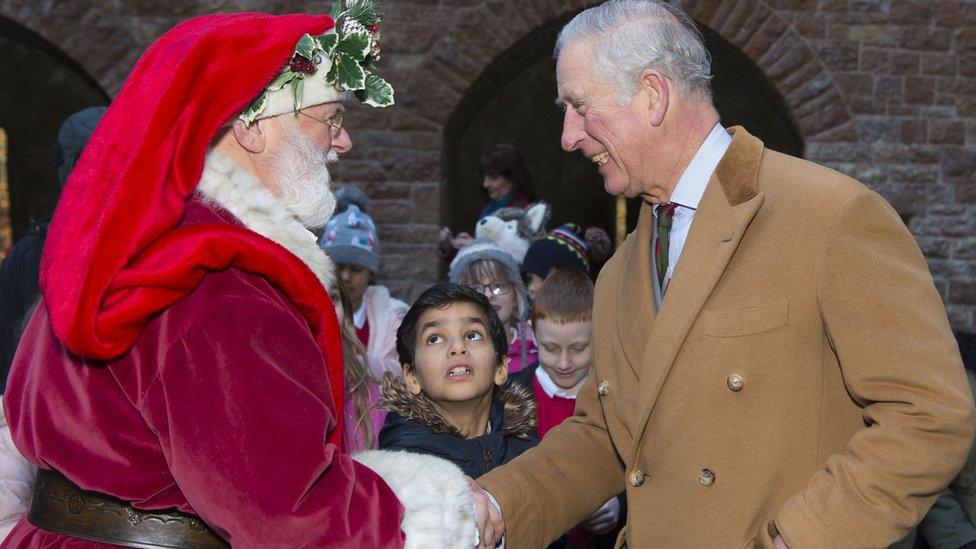 The Prince of Wales meets Father Christmas during a visit to Castell Coch, a 19th-century Gothic Revival castle in Tongwynlais, Cardiff