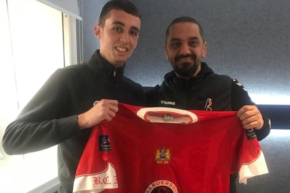 Ben Grice and Scott Murray holding a Bristol City football shirt between them