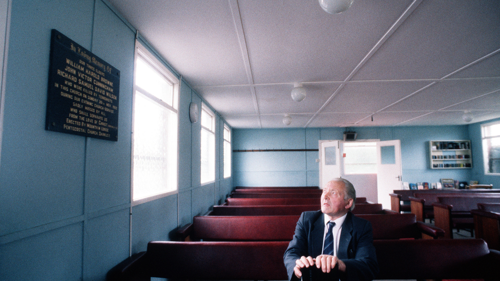 Pastor Bob Bain inside the gospel hall at Darkley