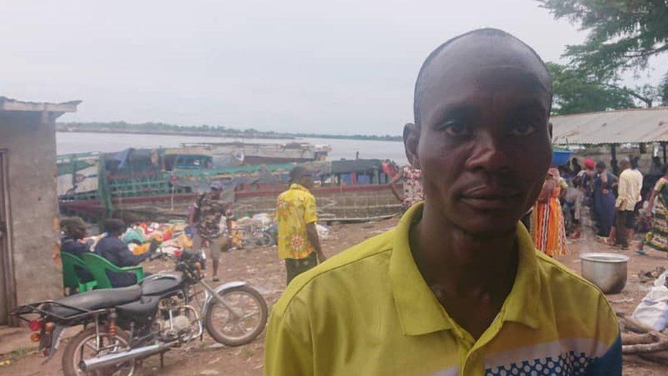 Korami Mopole standing in front of the river