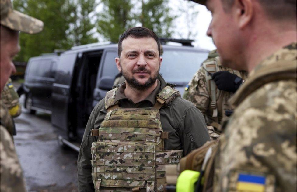 A handout photo from the Ukrainian Presidential Press Service shows President Volodymyr Zelensky meeting with Ukrainian servicemen during his visit to the Kharkiv region on 29 May