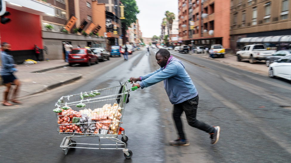 Helder Massingue with his trolley of vegetables in Hillbrow, Johannesburg, South Africa