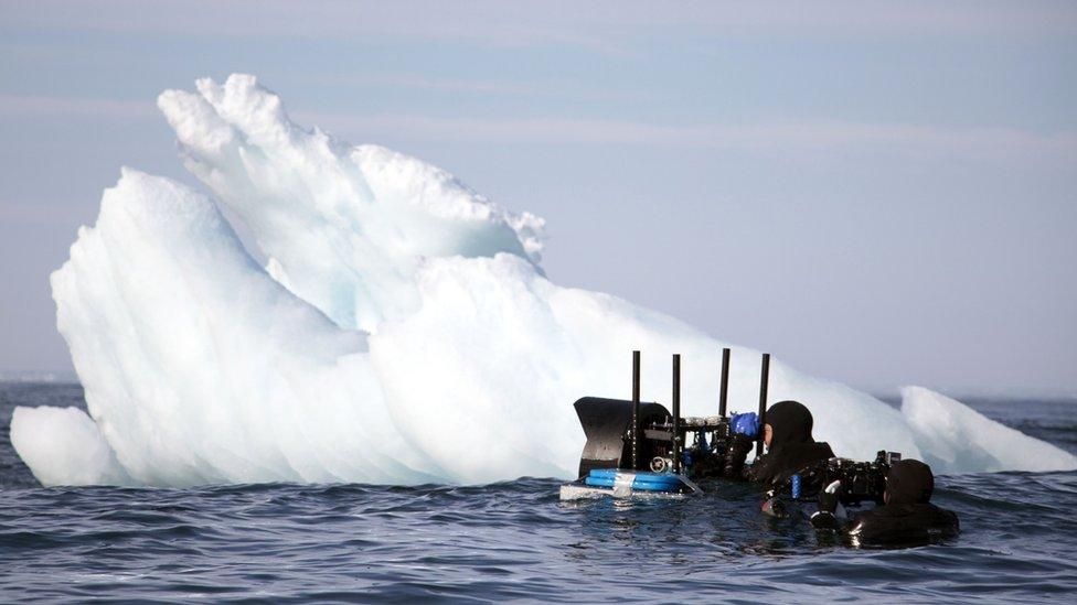 Cameraman David Reichert using the Megadome next to an iceberg, Svalbard, Arctic.