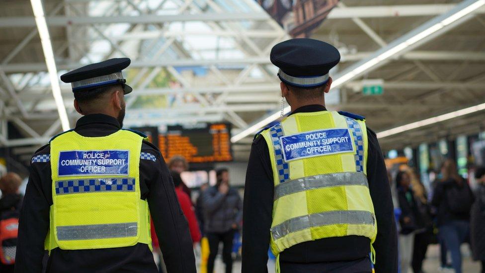 Two PCSOs patrolling bus station