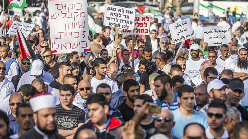 Arab Israelis take part in a rally organised by the High Follow-Up Committee for Arab Citizens of Israel, in protest against the demolition of Arab homes across the country, at Rabin Square in the Israeli city of Tel Aviv, on April 28, 2015