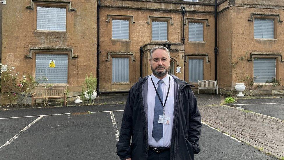 Councillor Paul Bradley outside the house