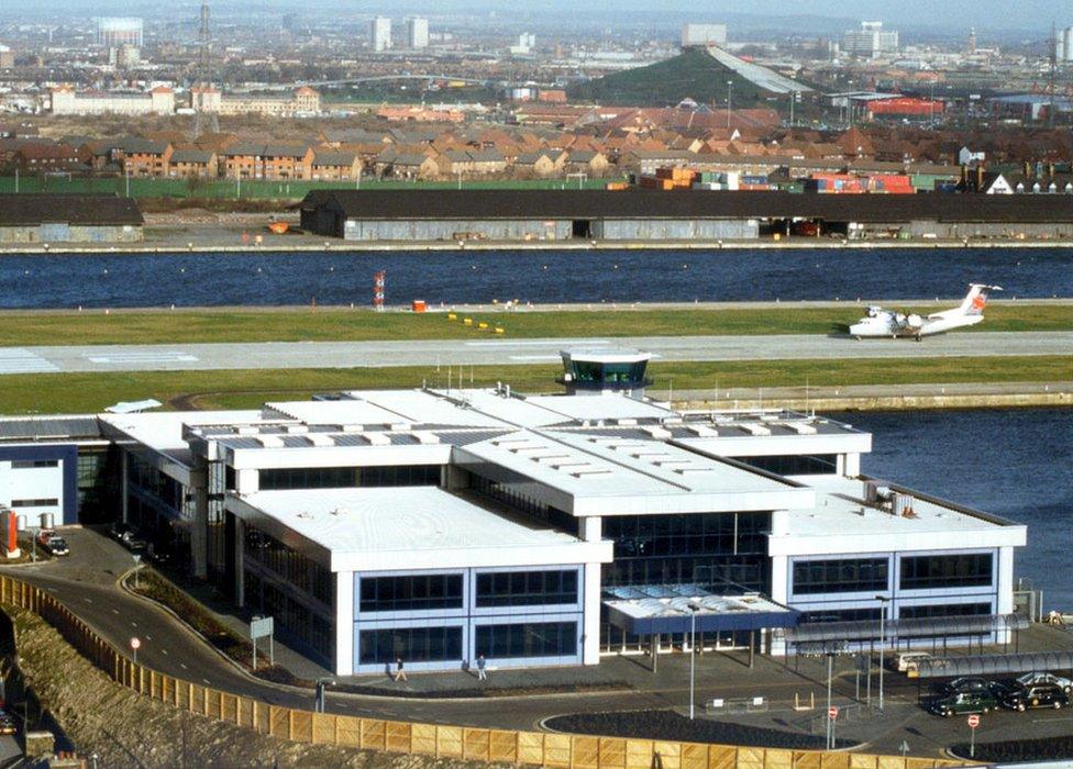 1987, facing north, the completed passenger terminal positioned south of the runway.