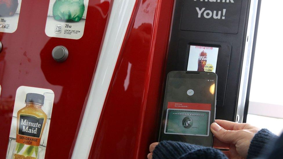 A Google employee gives a demonstration of Android Pay on a phone at Google I/O 2015 in San Francisco - 28 May 2015