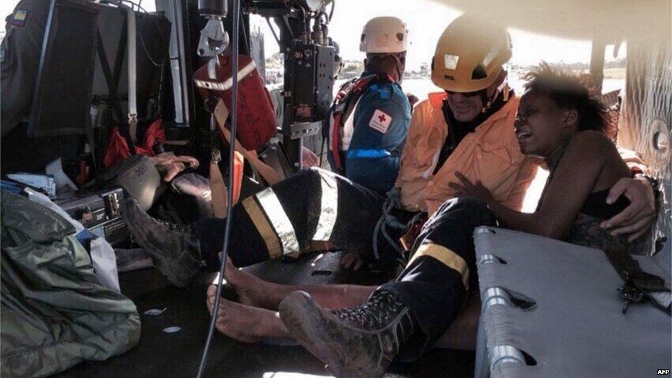 Nelly Murillo (right) as she and her baby are transported on a helicopter to a hospital in Quibdo after the light aircraft in which they were travelling crashed Saturday in the Colombian jungle