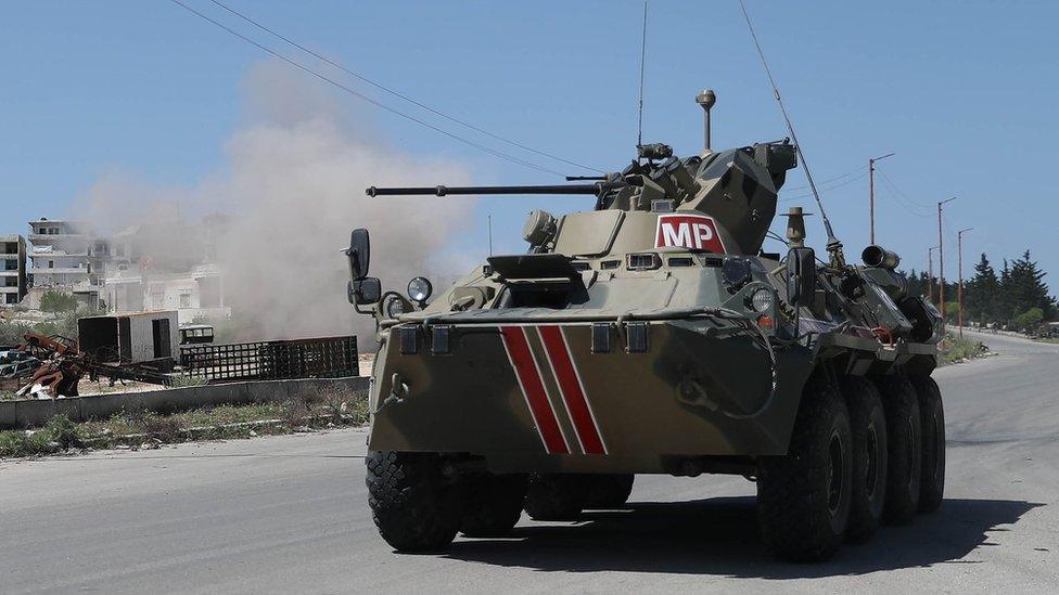 A Russian military police armoured personnel carrier drives along the M4 highway in Idlib province, Syria (12 May 2020)