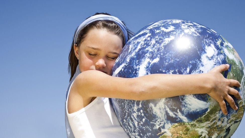 A-girl-holding-globe.