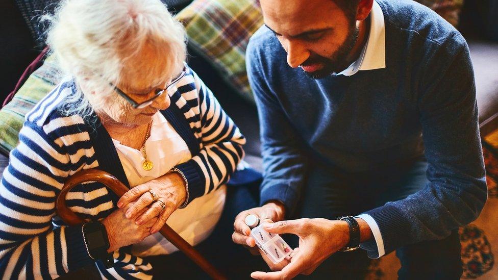 Doctor explaining medicine dosage to woman