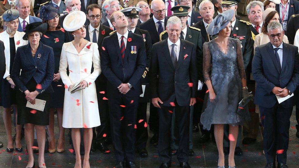 The prime minister stands alongside the Duke and Duchess of Cambridge, and the King and Queen of Belgium, under Menin Gate