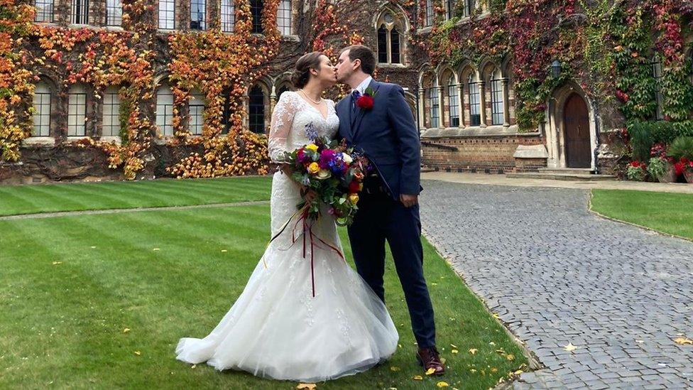 Megan and Tristan kissing after getting married