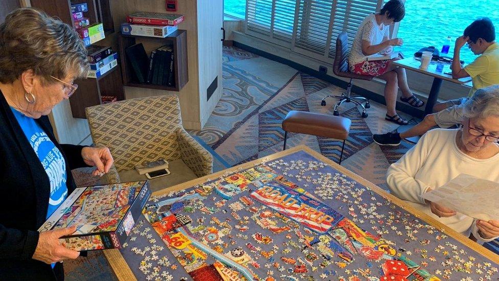 Cruise guests playing board games