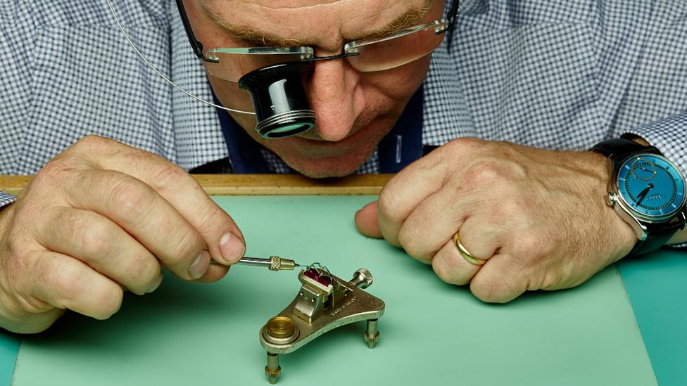 A man at work in Garrick's workshop