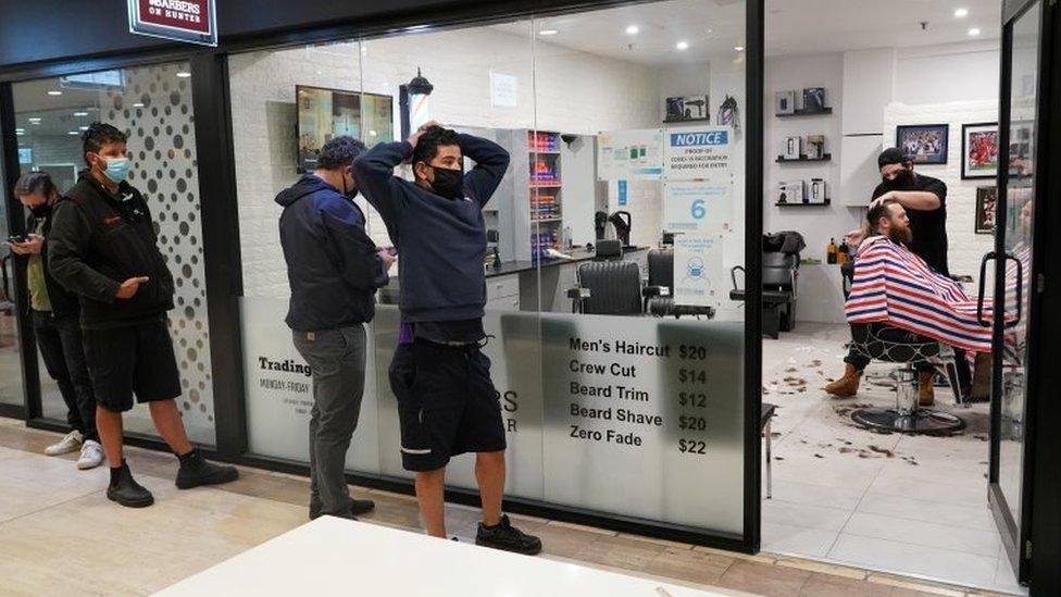 A queue outside a barber shop in Sydney on Monday