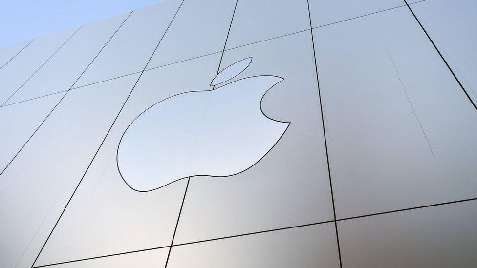 Apple logo is seen on the outside of an Apple store in San Francisco, California.