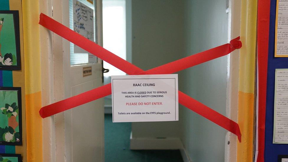 Red tape which has been placed across the entrance to a classroom warning of a 'RAAC ceiling' and advising that the area has been closed