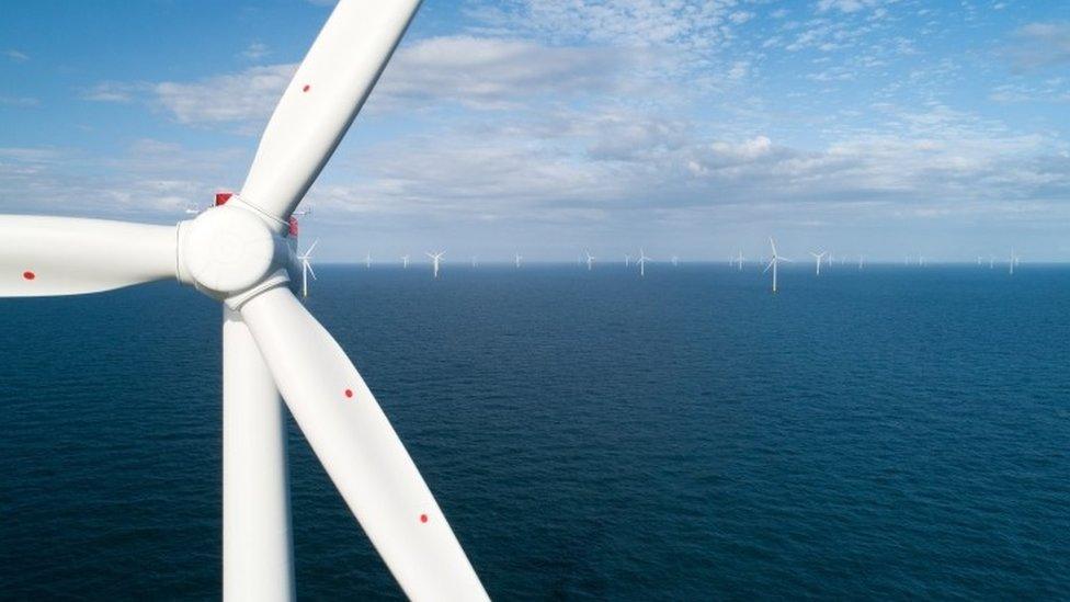 Close up of wind turbine at sea