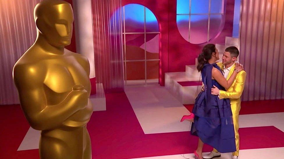 Priyanka Chopra Jonas and Nick Jonas embrace at the 93rd Academy Awards Nominations Announcement on March 15, 2021