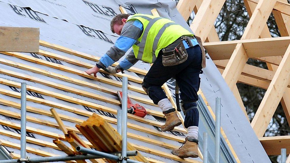 Roof worker building new house