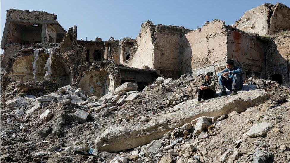 A view of the old city of Mosul and buildings destroyed during past fighting with Islamic State militants