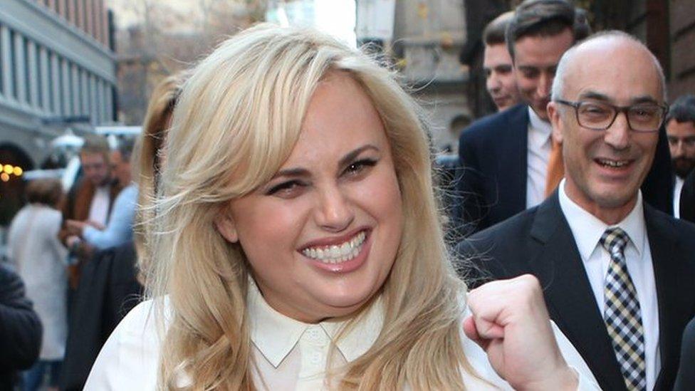 Rebel Wilson celebrates as she leaves court in Melbourne, Australia.