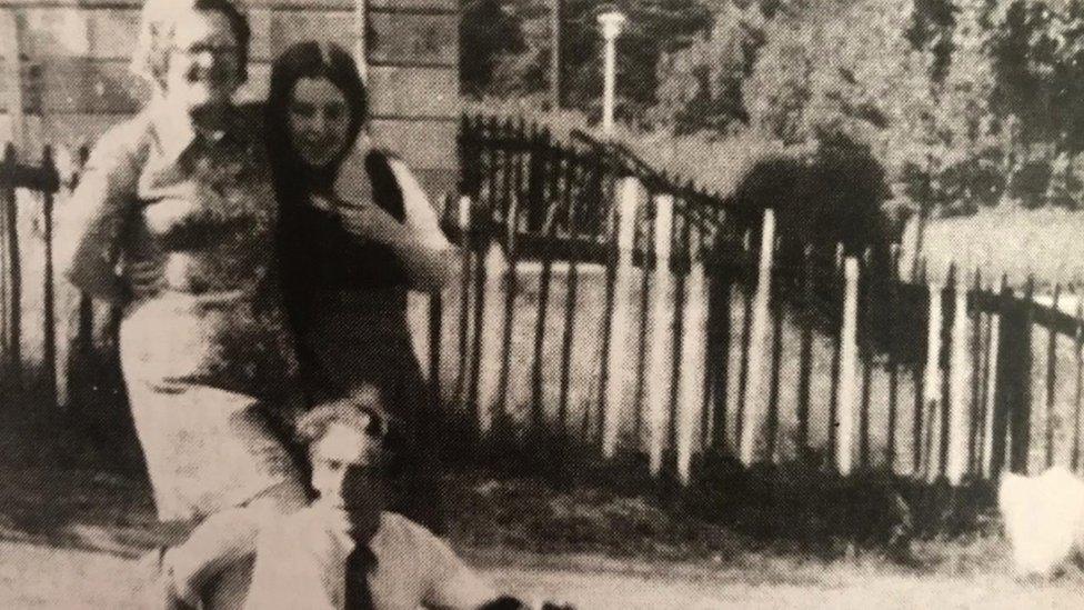 Majella pictured at home with her mother and father