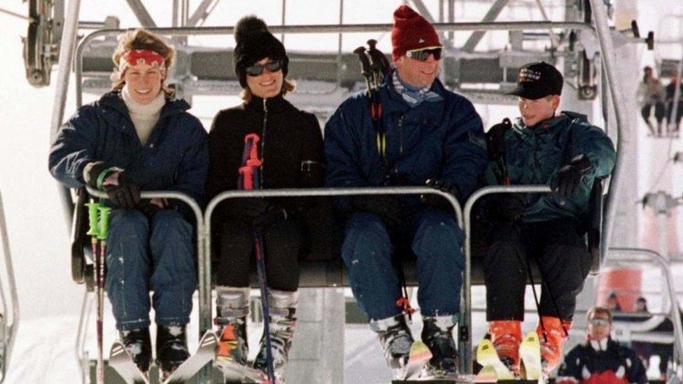 The Prince of Wales with Prince Harry, joined in a ski lift by (left to right) Santa with her sister, Tara Palmer-Tomkinson, on the way up the Gotschnabahn ski runs above Klosters, Switzerland, 1997