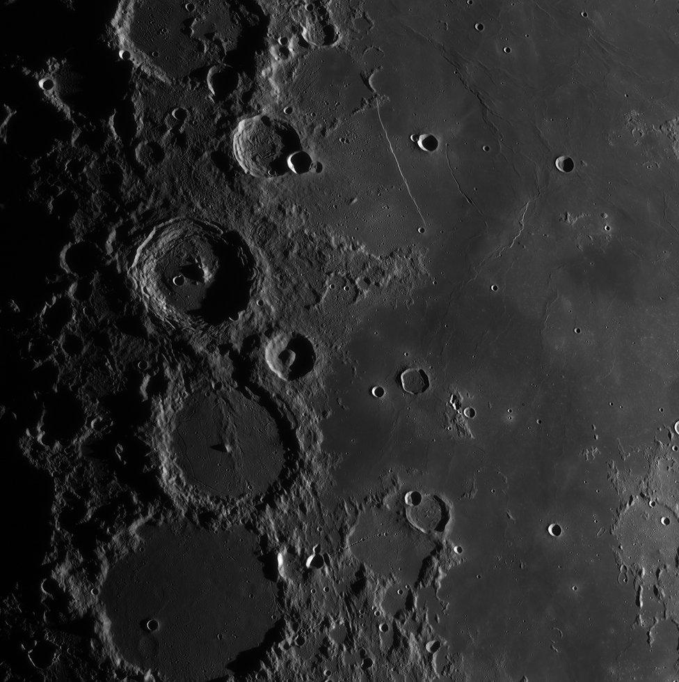 Craters on the surface of the moon.