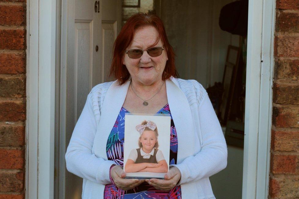 Megan Payne with photo of granddaughter