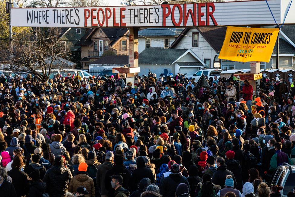 People gather as they celebrate at George Floyd Square after the verdict was announced in the trial of former police officer Derek Chauvin in Minneapolis, Minnesota, on 20 April 2021