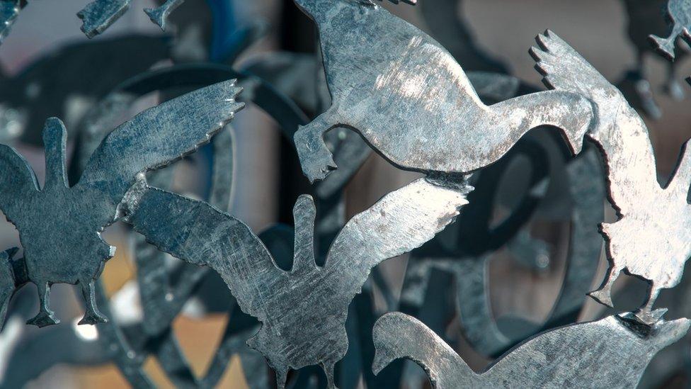 Metal detail on a sculpture of geese