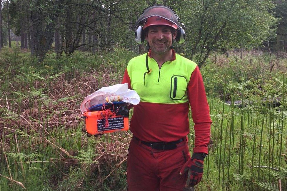 Member of Aberdeen Mountain Rescue Team and the rescued balloon